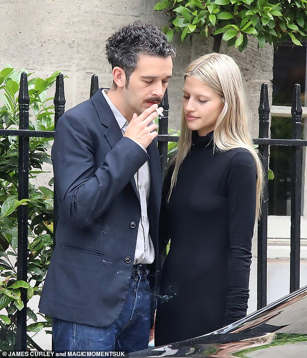 The singer, 35, was snapped puffing away on a cigarette outside the ceremony, held at Grosvenor House Hotel in London