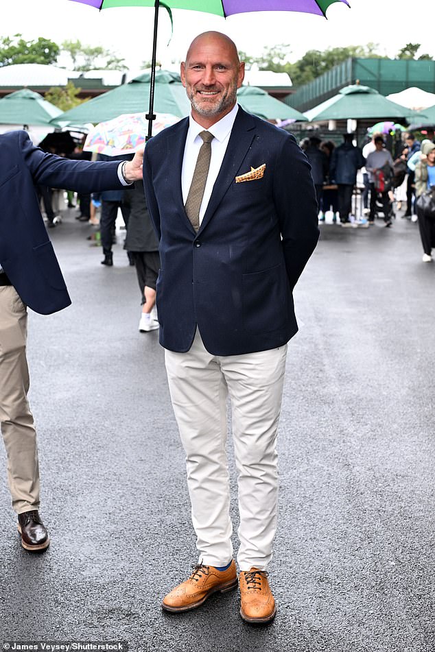 Rugby Union player Lawrence Dallaglio smartened up in a navy jacket and cream trousers
