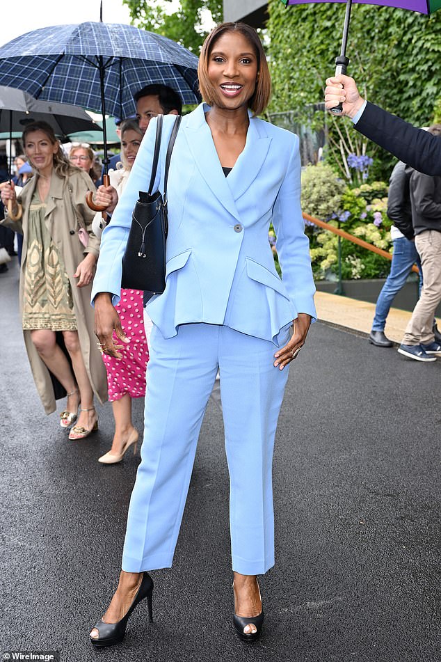 Denise Lewis, 51, opted for a sophisticated pale blue suit with an angular cut and a black leather handbag and heels
