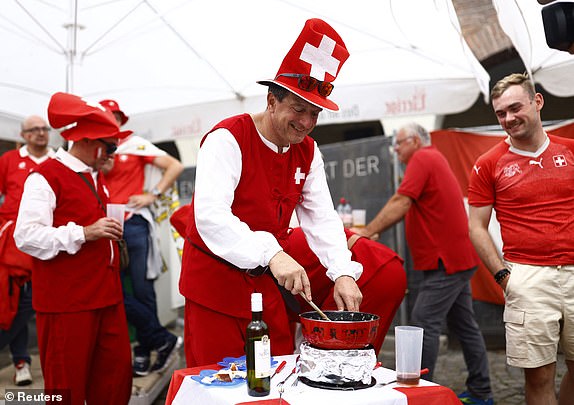 Soccer Football - Euro 2024 - Fans gather for England v Switzerland - Dusseldorf, Germany - July 6, 2024 Switzerland fans are seen ahead of England v Switzerland REUTERS/Leon Kuegeler