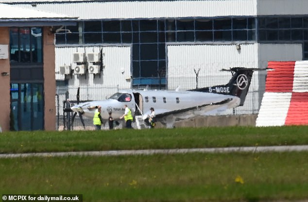 The WAG, 33, was seen boarding her plane at Manchester airport as she jets out to support her husband Kyle Walker