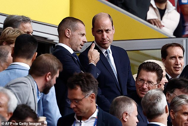 Prince William speaks with UEFA President Aleksander Ceferin (L) ahead of the quarter final