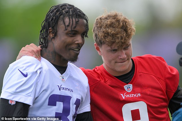 Jackson is pictured with quarterback and fellow draftee JJ McCarthy at rookie camp in May