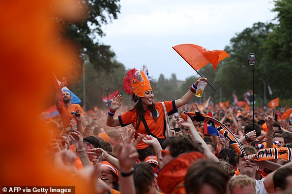 Dutch fans cheer outside the stadium prior to the UEFA Euro 2024 quarter-final football match between the Netherlands and Turkey at the Olympiastadion Berlin in Berlin on July 6, 2024. (Photo by Ronny HARTMANN / AFP) (Photo by RONNY HARTMANN/AFP via Getty Images)