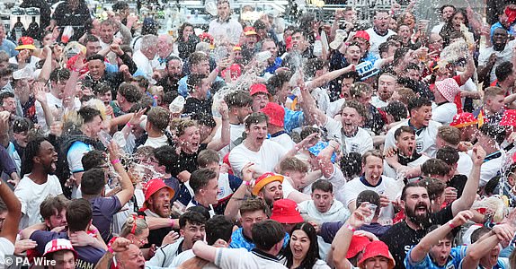 England fans react to the England goal at BOXPark, Wembley, during a screening of the UEFA Euro 2024, semi final match, between England and Switzerland. Picture date: Saturday July 6, 2024. See PA Story SOCCER England. Photo credit should read: James Manning/PA Wire.RESTRICTIONS: Use subject to restrictions. Editorial use only, no commercial use without prior consent from rights holder.