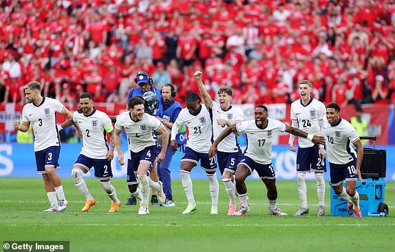 DUSSELDORF, GERMANY - JULY 06: Players of England celebrate after Trent Alexander-Arnold of England (not pictured) scores the team's fifth and winning penalty in the penalty shoot out during the UEFA EURO 2024 quarter-final match between England and Switzerland at DÃ¼sseldorf Arena on July 06, 2024 in Dusseldorf, Germany. (Photo by Alex Livesey/Getty Images)