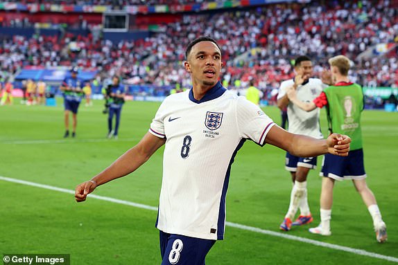 DUSSELDORF, GERMANY - JULY 06: Trent Alexander-Arnold of England celebrates scoring the team's fifth and winning penalty in the penalty shoot out during the UEFA EURO 2024 quarter-final match between England and Switzerland at DÃ¼sseldorf Arena on July 06, 2024 in Dusseldorf, Germany. (Photo by Richard Pelham/Getty Images)