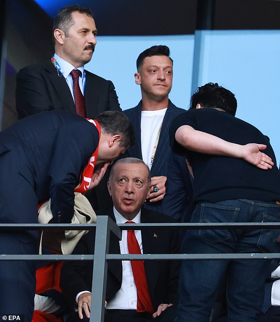 epa11463480 President of Turkey Recep Tayyip Erdogan (C), and former German soccer player Mesut Oezil (up) arrive for the UEFA EURO 2024 quarter-finals soccer match between Netherlands and Turkey, in Berlin, Germany, 06 July 2024.  EPA/CLEMENS BILAN