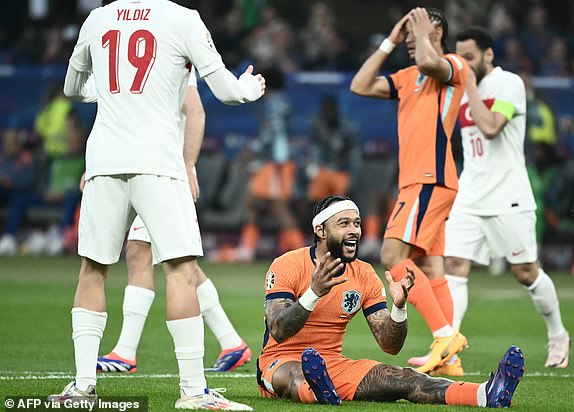 Netherlands' forward #10 Memphis Depay reacts to a missed chance during the UEFA Euro 2024 quarter-final football match between the Netherlands and Turkey at the Olympiastadion in Berlin on July 6, 2024. (Photo by Angelos Tzortzinis / AFP) (Photo by ANGELOS TZORTZINIS/AFP via Getty Images)