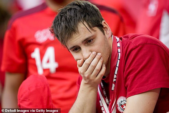 DUSSELDORF, GERMANY - JULY 6: The fans of the Swiss national team look disappointed after their team's defeat after the UEFA EURO 2024 quarter-final match between England and Switzerland at DÃ¼sseldorf Arena on July 6, 2024 in Dusseldorf, Germany. (Photo by Alex Gottschalk/DeFodi Images/DeFodi via Getty Images)