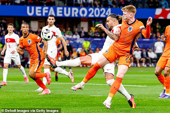 BERLIN, GERMANY - JULY 6: AbdÃ¼lkerim Bardakci of Turkiye battles for possession with Jerdy Schouten of Netherlands during the UEFA EURO 2024 quarter-final match between Netherlands and TÃ¼rkiye at Olympiastadion on July 6, 2024 in Berlin, Germany. (Photo by Marcel ter Bals/DeFodi Images/DeFodi via Getty Images)
