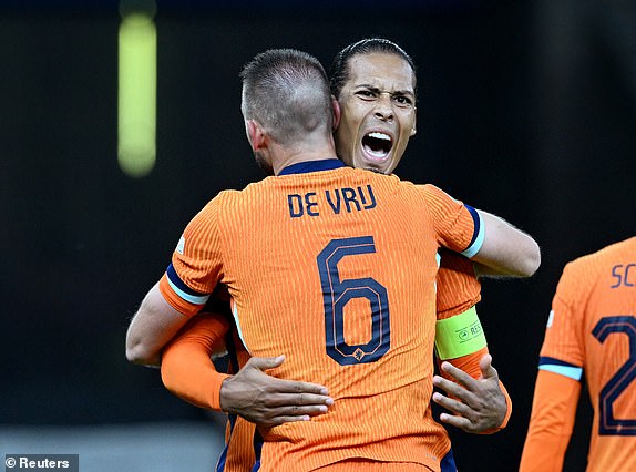 Soccer Football - Euro 2024 - Quarter Final - Netherlands v Turkey - Berlin Olympiastadion, Berlin, Germany - July 6, 2024 Netherlands' Stefan de Vrij celebrates scoring their first goal with Virgil van Dijk REUTERS/Carmen Jaspersen