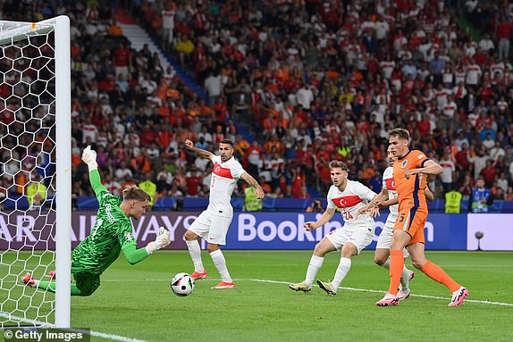 BERLIN, GERMANY - JULY 06: Bart Verbruggen of the Netherlands makes a save during the UEFA EURO 2024 quarter-final match between Netherlands and TÃ¼rkiye at Olympiastadion on July 06, 2024 in Berlin, Germany. (Photo by Stu Forster/Getty Images)