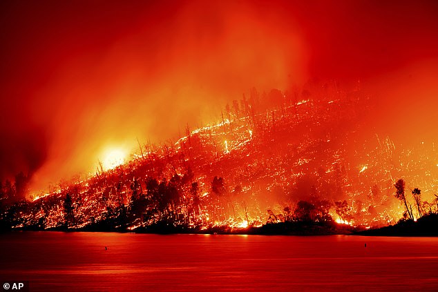 The Thompson fire, seen here, broke out just before noon on Tuesday around 70 miles north of the state capital Sacramento