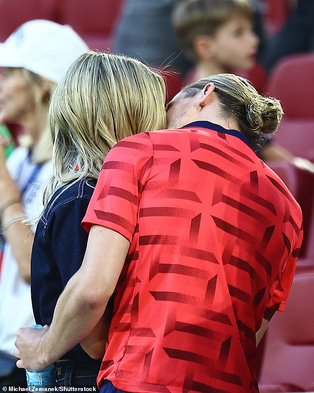 Model Aine couldn't wipe the smile off her face as she congratulated the hunky footballer after watching the game alongside her fellow WAGs