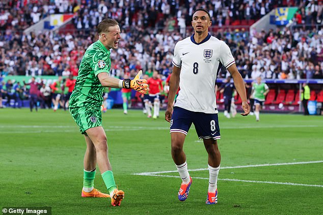 The England goalkeeper celebrated with Trent Alexander-Arnold, who scored the winning penalty