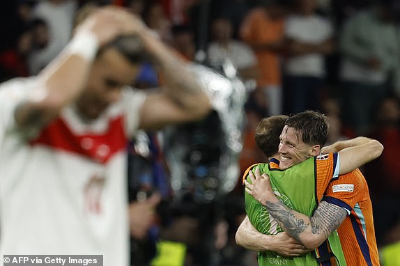 Netherlands' forward #09 Wout Weghorst celebrates with a teammate after the UEFA Euro 2024 quarter-final football match between the Netherlands and Turkey at the Olympiastadion in Berlin on July 6, 2024. (Photo by Odd ANDERSEN / AFP) (Photo by ODD ANDERSEN/AFP via Getty Images)