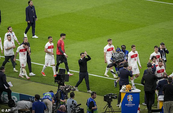 Turkey's head coach Vincenzo Montella, center, applauds at the end of the quarterfinal match between the Netherlands and Turkey at the Euro 2024 soccer tournament in Berlin, Germany, Saturday, July 6, 2024. (AP Photo/Markus Schreiber)