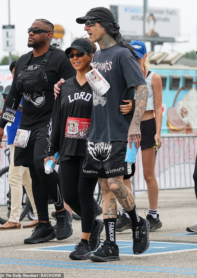 Barker 48, chose black for the event, donning a short sleeve T-shirt with a Transplants graphic on it and Famous Stars and Straps shorts and socks with black sneakers