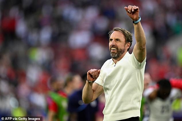 England's head coach Gareth Southgate celebrates pitchside after England's win