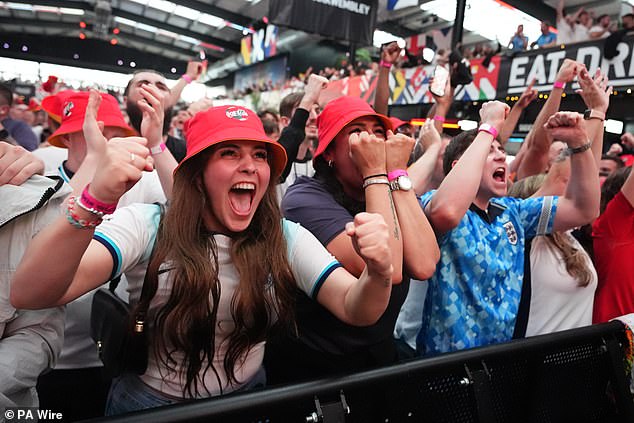 England fans across the country went wild after Gareth Southgate's men beat Switzerland  (pictured are supporters at Wembley's Boxpark, in London)