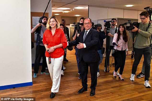 Former French president and member of French left-wing Socialist Party (PS) and candidate for the left wing coalition Nouveau Front Populaire (NFP) in the Correze department, Francois Hollande (R) with his wife French actress Julie Gayet as they arrived at a polling station in Tulle to cast their votes