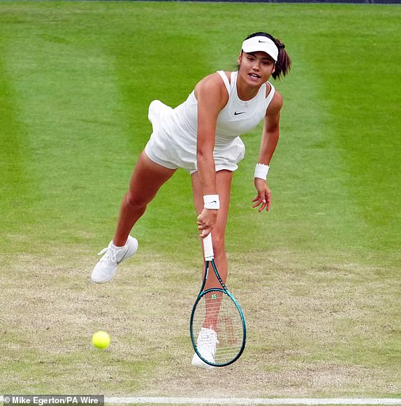 Emma Raducanu in action against Lulu Sun on day seven of the 2024 Wimbledon Championships at the All England Lawn Tennis and Croquet Club, London. Picture date: Sunday July 7, 2024. PA Photo. See PA story TENNIS Wimbledon. Photo credit should read: Mike Egerton/PA Wire.RESTRICTIONS: Editorial use only. No commercial use without prior written consent of the AELTC. Still image use only - no moving images to emulate broadcast. No superimposing or removal of sponsor/ad logos.