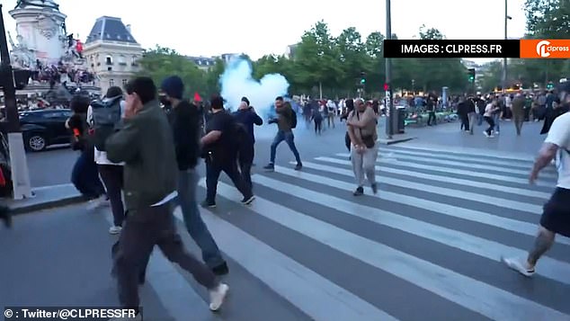 Rioters in Paris set off flares as thousands took to the streets to celebrate or protest the election results