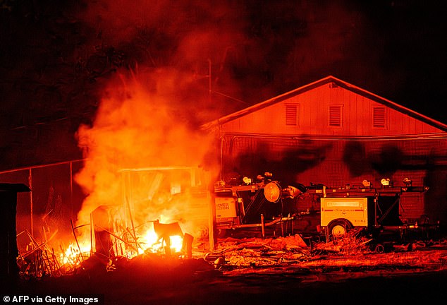 Pictured: The French Fire rips through a house in Mariposa County