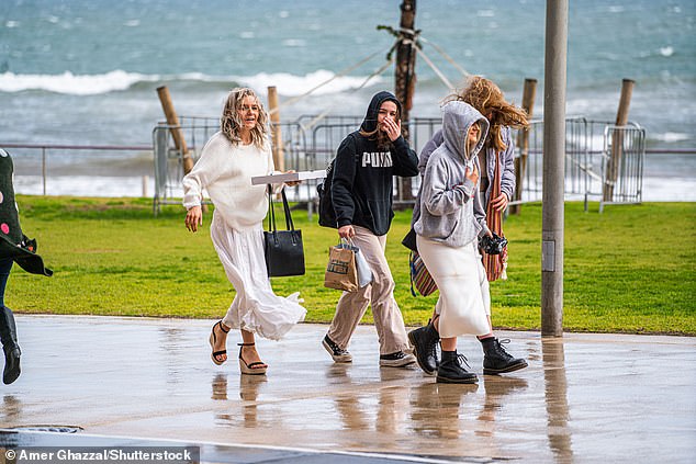 Heavy rain forecast to drench large parts of the country this week could be the start of a wetter-than-average winter and spring for most Australians (people in Adelaide are pictured)