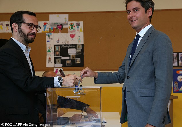 French Prime Minister Gabriel Attal was pictured at a polling station in Vanves this morning after casting his ballot in the second round of parliamentary voting