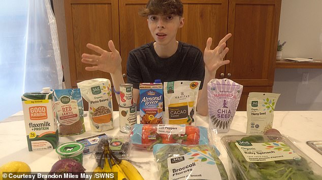 A recent picture of the 35-year-old next to a selection of healthy foods. When he was 15, he started drinking green tea and eating more plant based foods