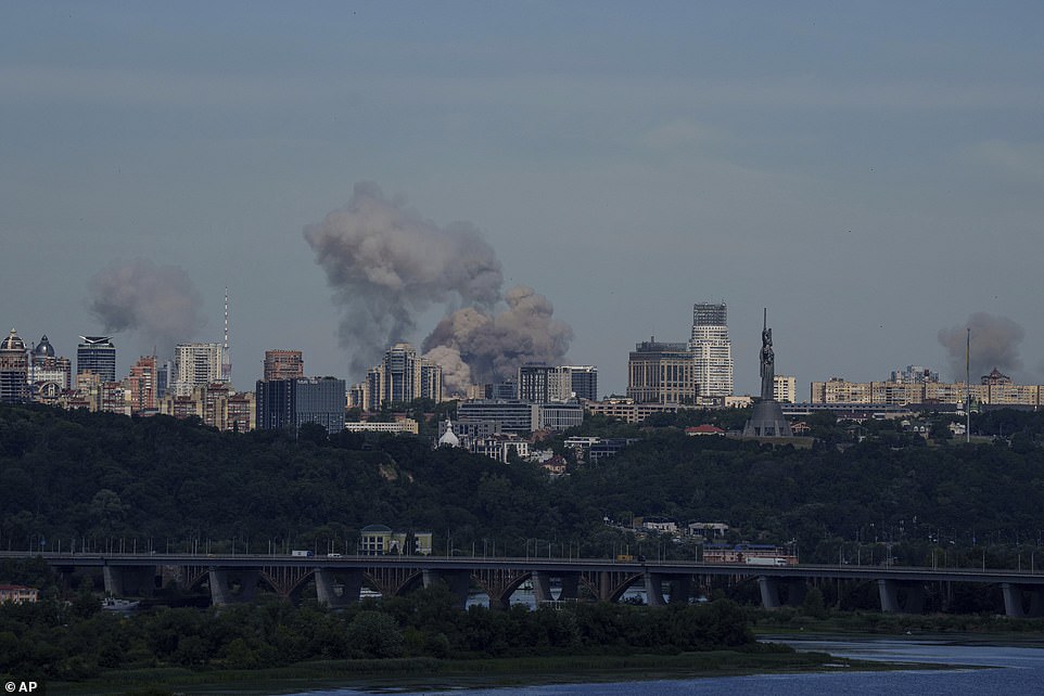 Smoke rises over the Kyiv skyline after a Russian attack, Monday, July 8, 2024