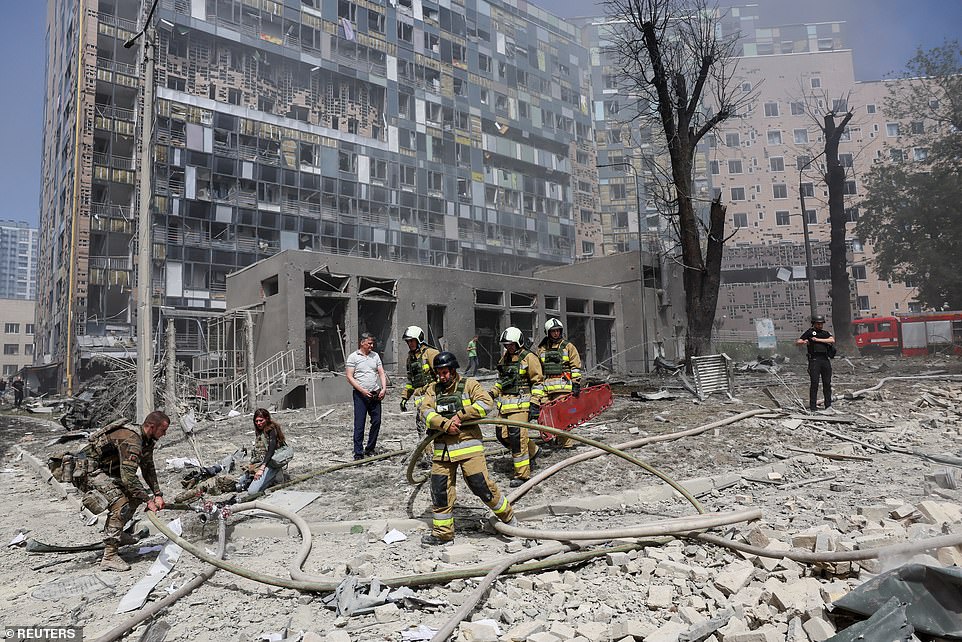 Rescuers work at a site of a building damaged during a Russian missile strikes, amid Russia's attack on Ukraine, in Kyiv, Ukraine July 8, 2024