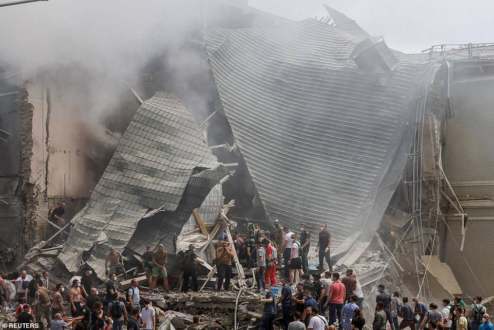 Rescuers work at Ohmatdyt Children's Hospital that was damaged during a Russian missile strikes