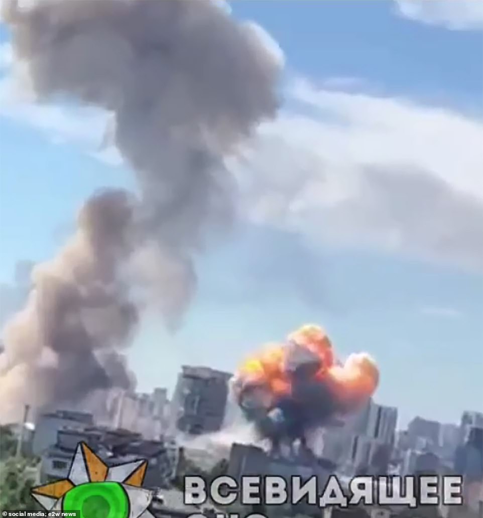 A huge fireball is seen rising over Kyiv next to another smoke plume today