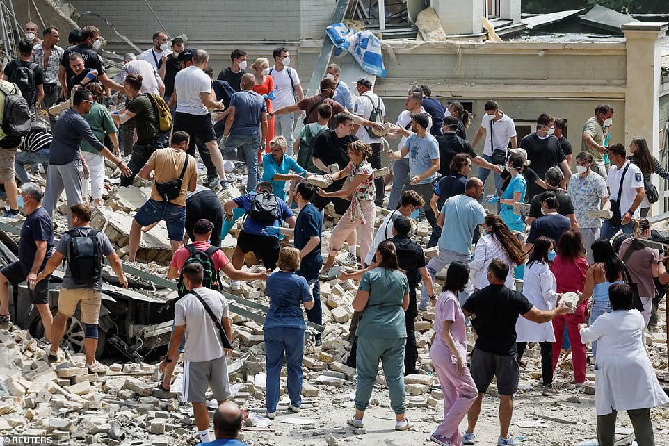 Rescuers work at Ohmatdyt Children's Hospital that was damaged during Russian missile strikes, amid Russia's attack on Ukraine, in Kyiv, Ukraine July 8, 2024