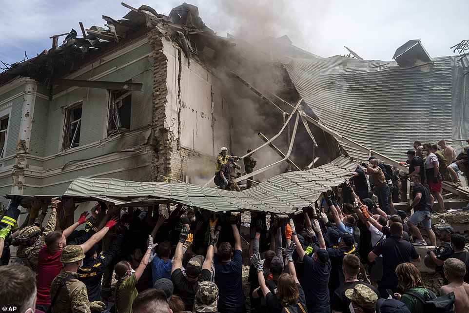 Emergency services work at the site of Okhmatdyt children's hospital hit by Russian missiles, in Kyiv, Ukraine