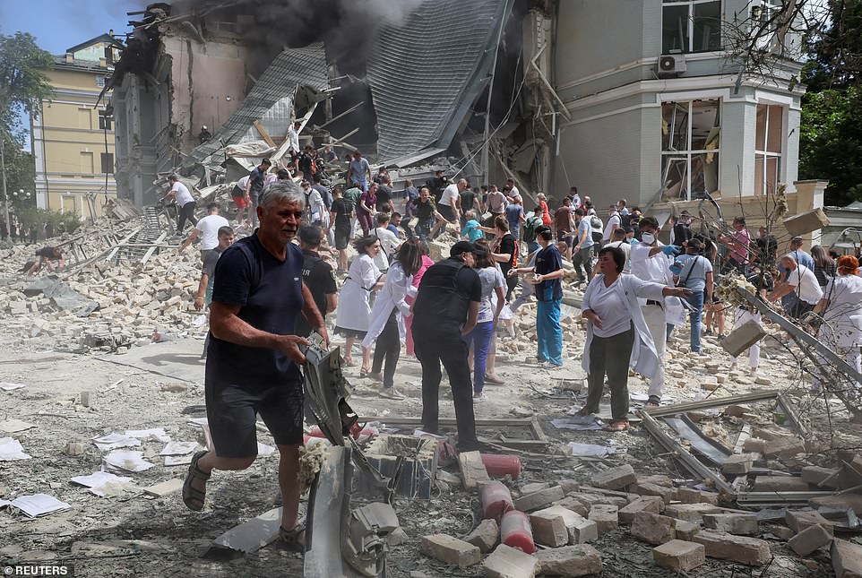 Rescuers work at Ohmatdyt Children's Hospital that was damaged during Russian missile strikes