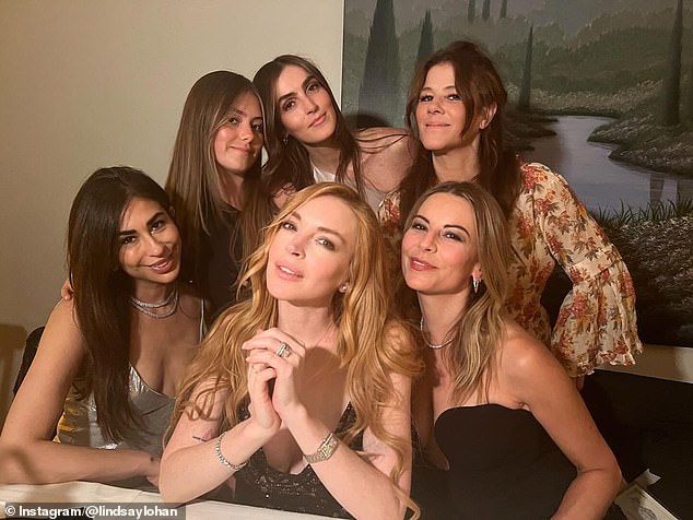 Lindsay with a group of her pals as well as her sister Aliana