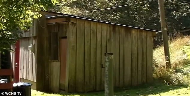 The backyard shed where two of the couple's teenage adopted children were found. Cops say there was no way to open the door from the inside, and the kids were found without food or water