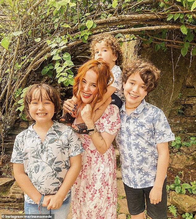 The Minas Gerais Civil Police is awaiting results of an autopsy to determine the cause of Brazilian influencer Mariana Mamade (pictured here with her three children)