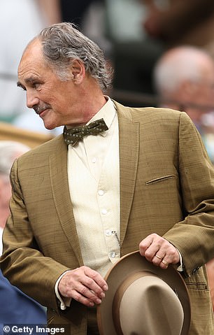 He looked smart as his made his way around the royal box at Centre Court