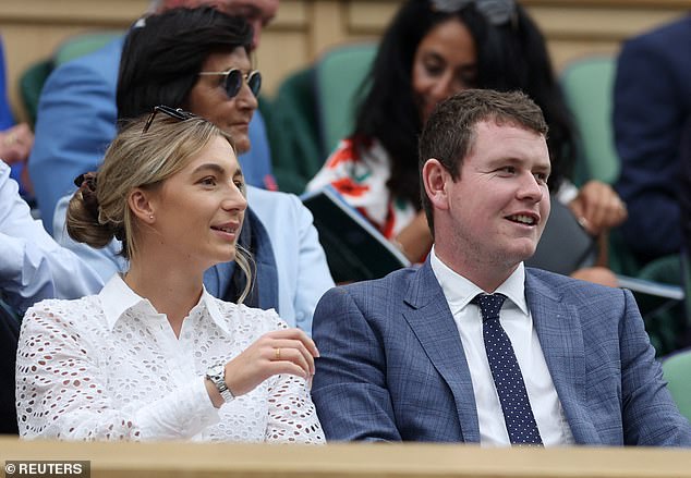 Scottish golger Robert MacIntyre and his partner Shannon Hartley are pictured in the royal box today