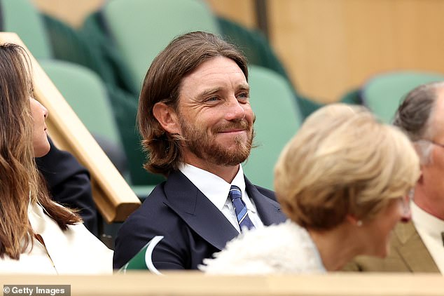 Tommy Fleetwood looked dapper in a navy suit and stripy blue tie for the eighth day of Wimbledon