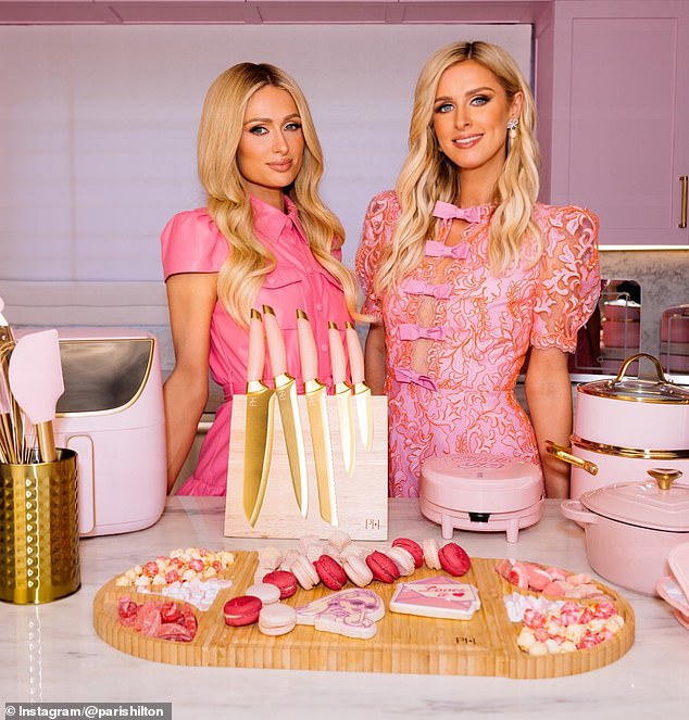 Paris Hilton looked pretty in pink while posing with her sister Nicky on Thursday