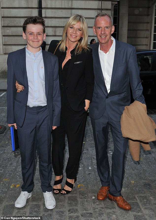 Woody pictured with both his parents in 2015