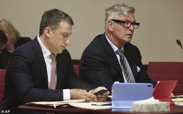 In court on Monday, Baldwin sat between his attorneys and thumbed through papers, wearing glasses and close-cropped hair