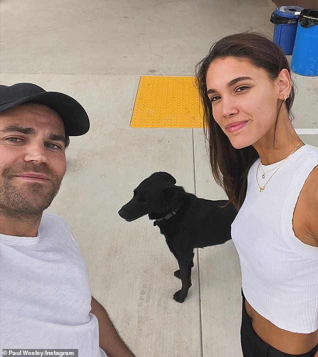 The licensed health coach shares custody of her beloved rescue dog Gregory aka 'Greggy' with her ex-husband - The Vampire Diaries alum Paul Wesley (L, pictured February 14) - who has since moved on with 24-year-old German model Natalie Kuckenburg (R)