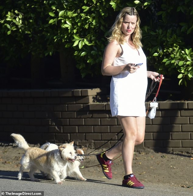 Heading out to walk her three dogs on Monday, Georgia displayed her growing bump in a white v-neck summer dress